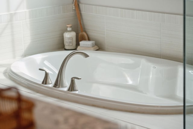 bathroom featuring a relaxing tiled tub