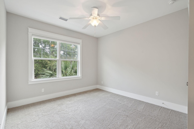 carpeted empty room featuring ceiling fan