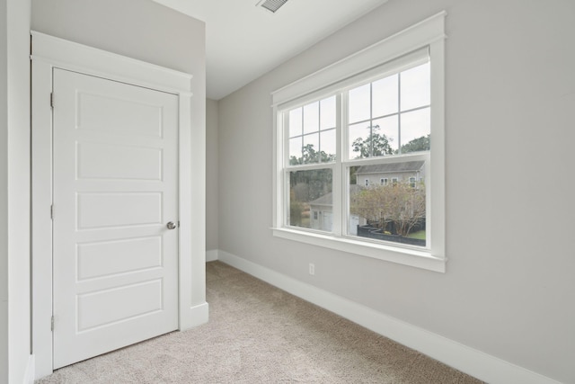 unfurnished bedroom with light carpet