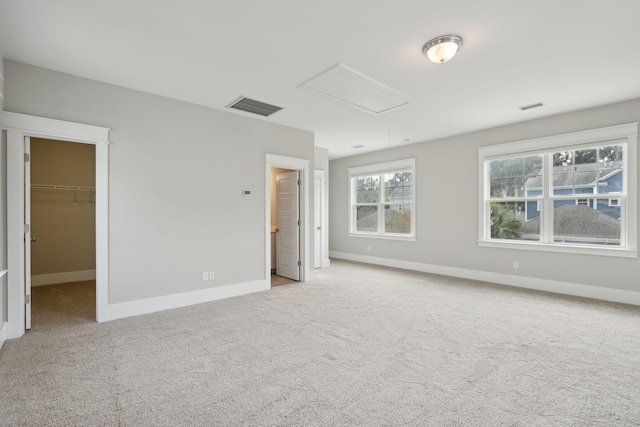 unfurnished room with light colored carpet