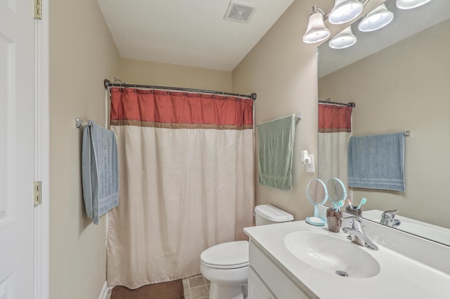 full bath featuring visible vents, toilet, tile patterned flooring, a textured ceiling, and vanity