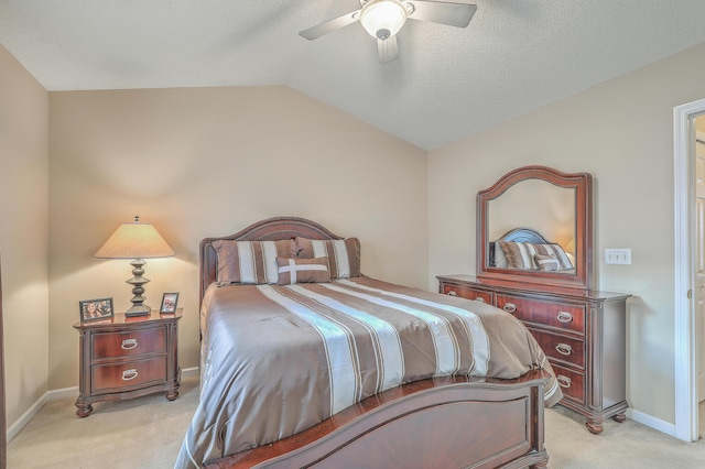 bedroom featuring lofted ceiling, light colored carpet, a ceiling fan, a textured ceiling, and baseboards