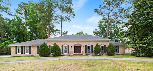 2266 Griffith Dr, Orangeburg, SC 29118 - view of front facade featuring french doors, a front lawn, and driveway