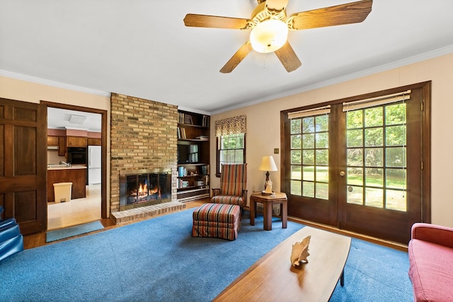 2266 Griffith Dr, Orangeburg, SC 29118 - living area featuring ornamental molding, a ceiling fan, french doors, and a brick fireplace