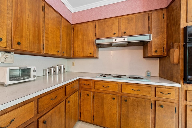 kitchen with ornamental molding, white electric cooktop, and light tile patterned floors