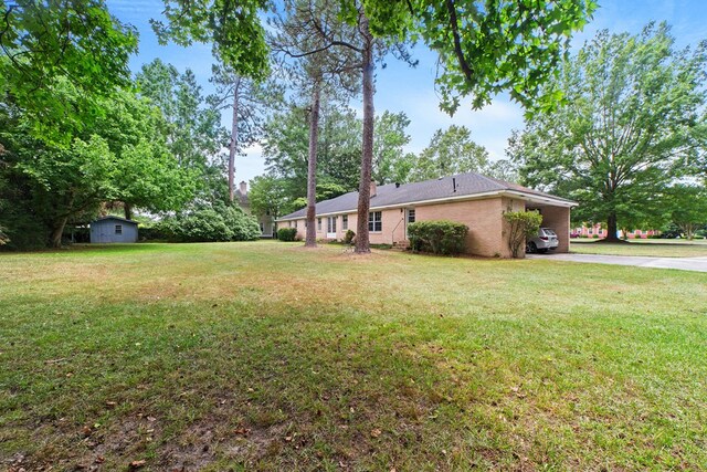 2266 Griffith Dr, Orangeburg, SC 29118 - view of yard with driveway and a carport