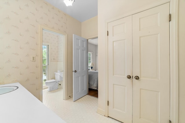 2266 Griffith Dr, Orangeburg, SC 29118 - bathroom with tile patterned flooring, a sink, toilet, and wallpapered walls