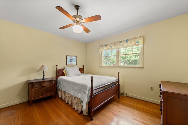 bedroom with ceiling fan and light hardwood / wood-style floors