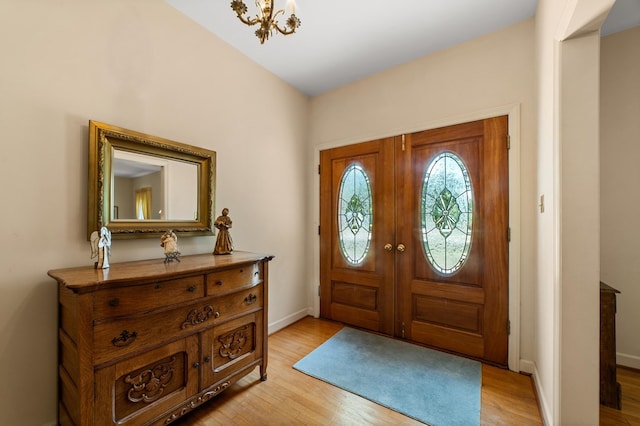 2266 Griffith Dr, Orangeburg, SC 29118 - entryway featuring baseboards, light wood finished floors, and a chandelier