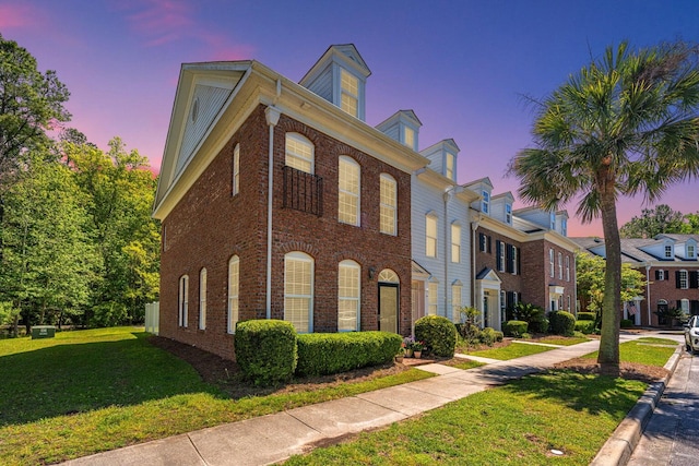 view of front of property with a yard