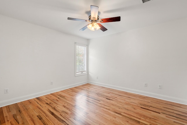 unfurnished room with ceiling fan and light wood-type flooring