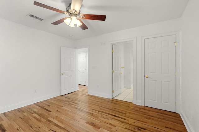 full bathroom featuring baseboards, tile patterned floors, a stall shower, and toilet