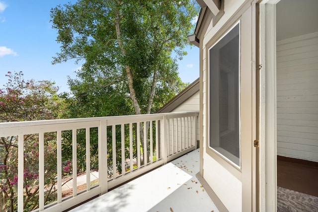 wooden terrace featuring fence