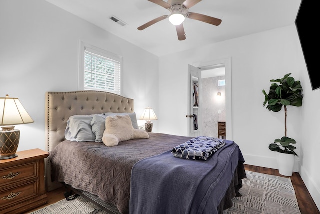 bedroom featuring wood finished floors, a ceiling fan, and baseboards