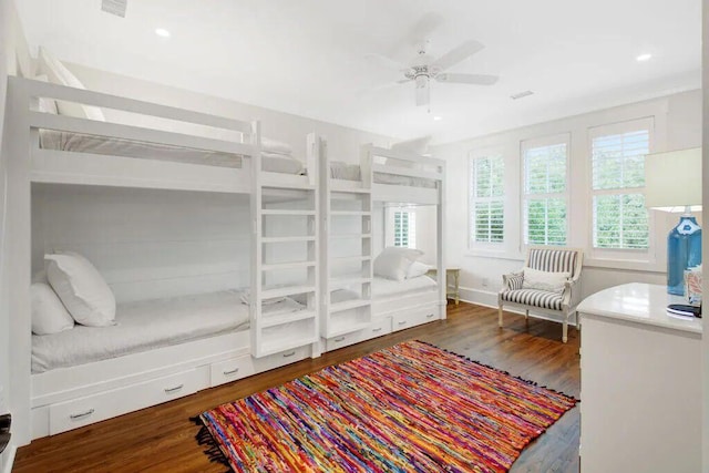 bedroom featuring dark wood finished floors and recessed lighting