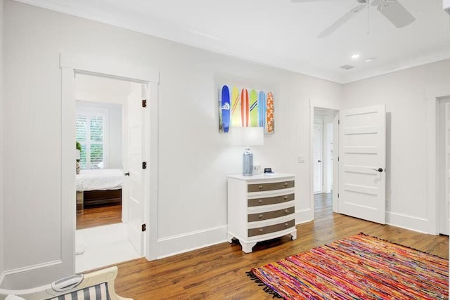 interior space with wood finished floors and baseboards