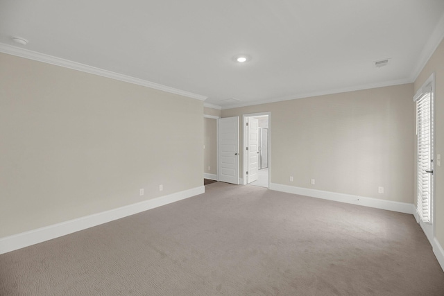 unfurnished bedroom with crown molding, carpet floors, and ensuite bath