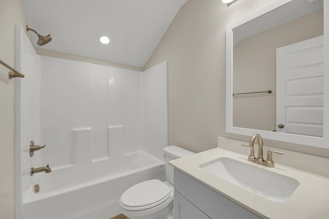 full bathroom with shower / tub combination, lofted ceiling, vanity, and toilet