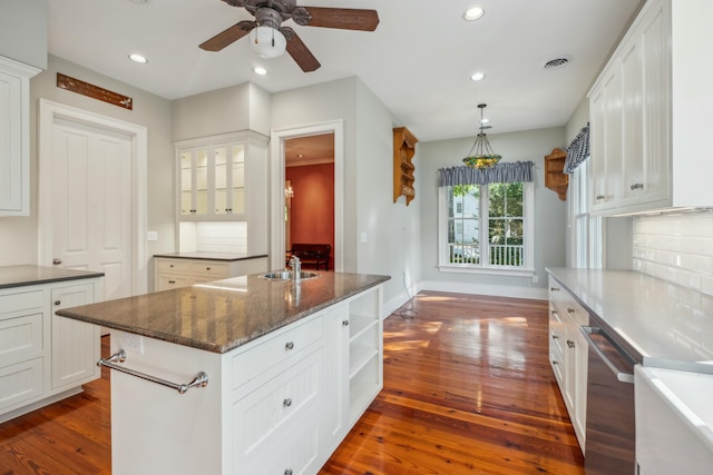 707 Royall Ave, Mount Pleasant, SC 29464 - kitchen with a sink, white cabinetry, stainless steel dishwasher, ceiling fan, and dark wood-style floors