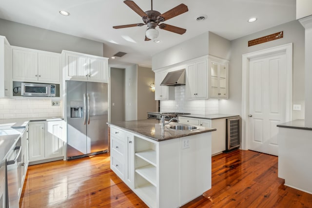 707 Royall Ave, Mount Pleasant, SC 29464 - kitchen featuring wine cooler, backsplash, appliances with stainless steel finishes, and a sink