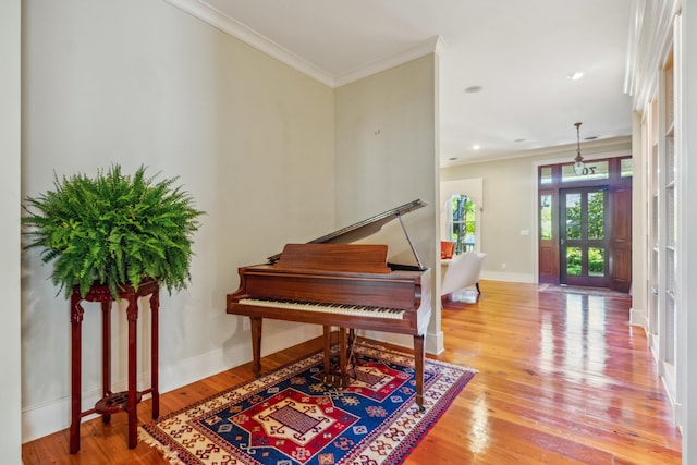 707 Royall Ave, Mount Pleasant, SC 29464 - foyer with crown molding, light wood-style floors, and baseboards
