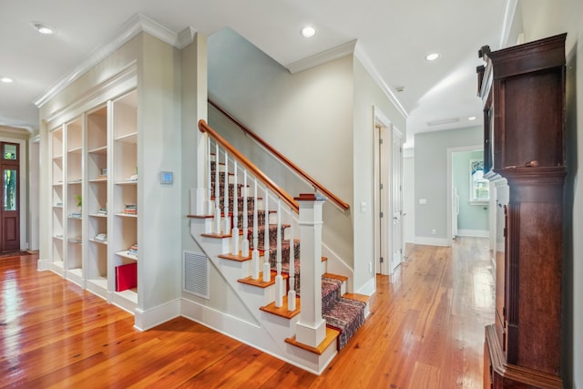 707 Royall Ave, Mount Pleasant, SC 29464 - hall with crown molding, light wood-style flooring, stairs, and visible vents