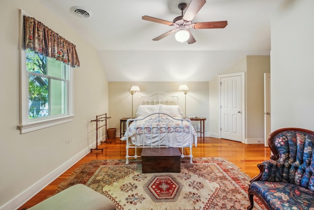 707 Royall Ave, Mount Pleasant, SC 29464 - bedroom with lofted ceiling, a ceiling fan, baseboards, visible vents, and wood finished floors