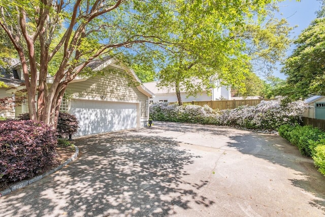 707 Royall Ave, Mount Pleasant, SC 29464 - garage featuring concrete driveway and fence