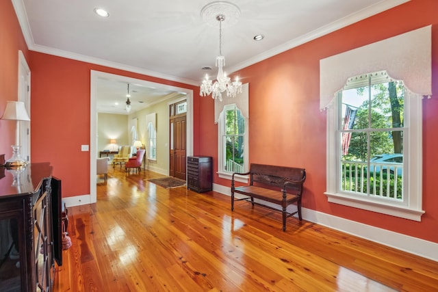 707 Royall Ave, Mount Pleasant, SC 29464 - living area featuring a wealth of natural light, hardwood / wood-style flooring, and a notable chandelier