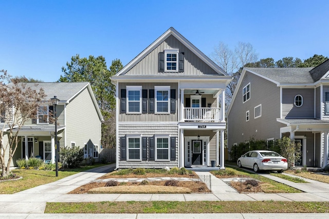 view of front of house featuring board and batten siding and a balcony