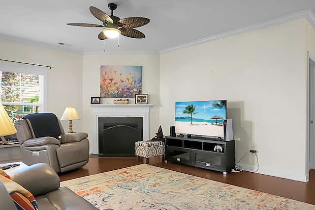 living room featuring ceiling fan, crown molding, and dark hardwood / wood-style floors