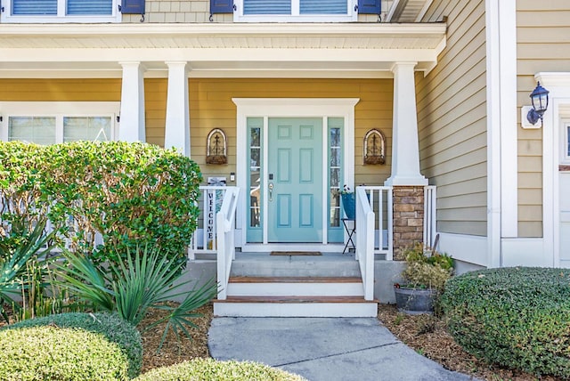 property entrance with covered porch