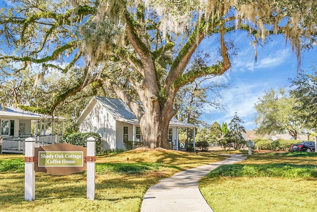 view of property's community with a lawn