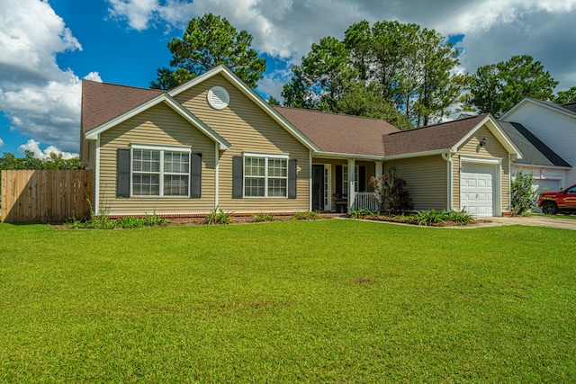 ranch-style house featuring a garage and a front yard