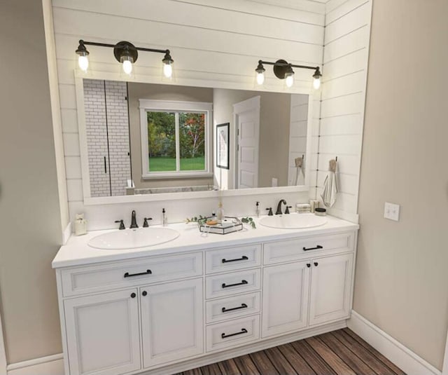 213 Myrtlewood Dr, Santee, SC 29142 - bathroom with a sink, double vanity, baseboards, and wood finished floors