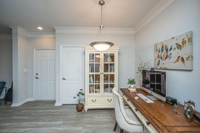 home office with crown molding and wood-type flooring