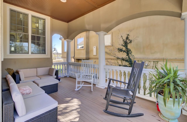 wooden deck featuring outdoor lounge area
