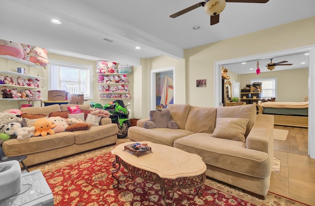 tiled living area featuring recessed lighting, visible vents, beam ceiling, and a ceiling fan