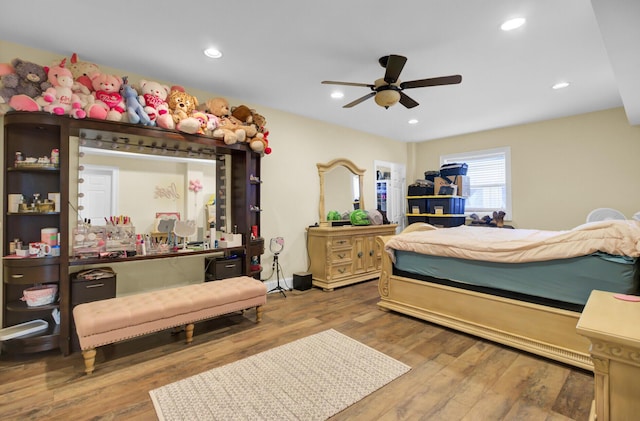 bedroom featuring recessed lighting, wood finished floors, and a ceiling fan