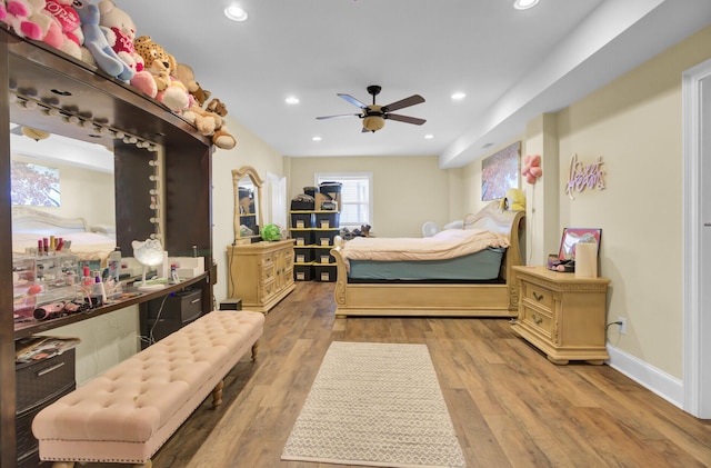 bedroom with recessed lighting, wood finished floors, baseboards, and ceiling fan