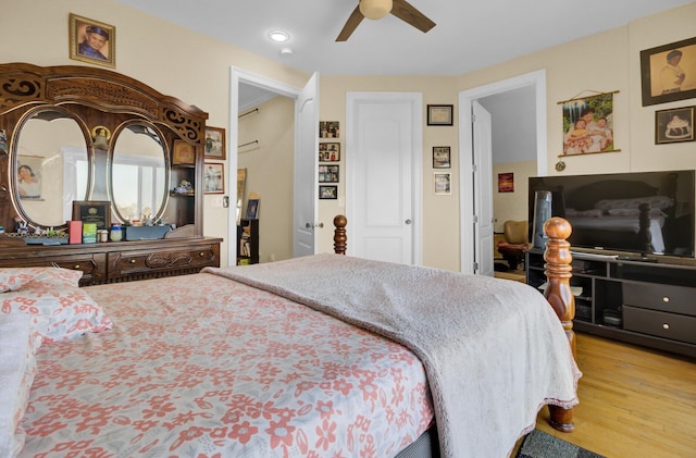 bedroom with a ceiling fan, recessed lighting, and wood finished floors