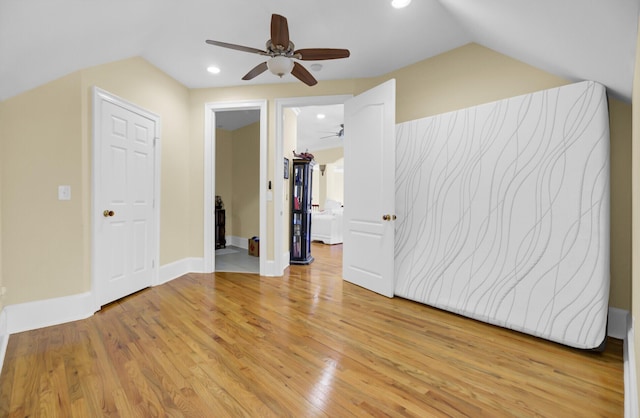 bonus room with a ceiling fan, baseboards, light wood-style flooring, recessed lighting, and vaulted ceiling