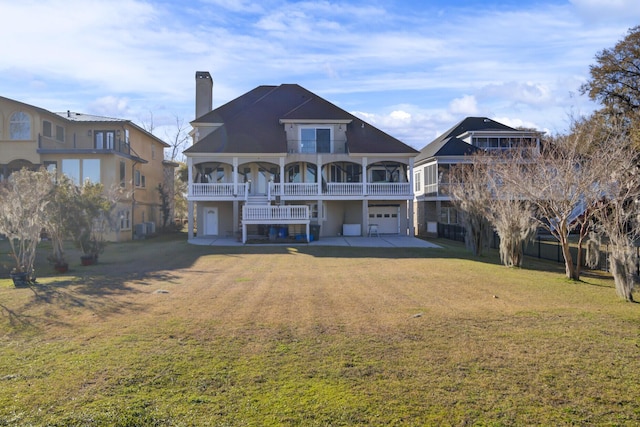 rear view of property featuring driveway, central AC, a chimney, a garage, and a lawn