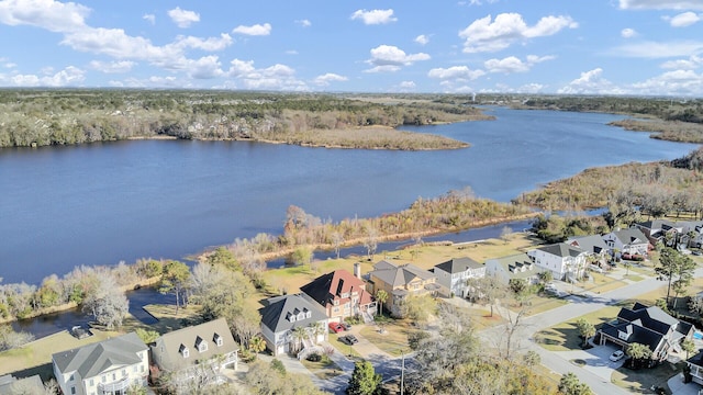 drone / aerial view featuring a residential view and a water view