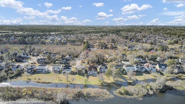 drone / aerial view featuring a residential view and a water view