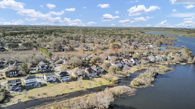 drone / aerial view with a water view and a residential view