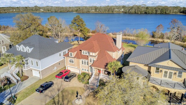 aerial view with a residential view and a water view