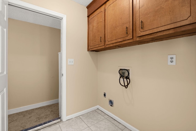 8116 Long Shadow Ln, North Charleston, SC 29406 - washroom featuring hookup for an electric dryer, washer hookup, cabinet space, light tile patterned floors, and a textured ceiling