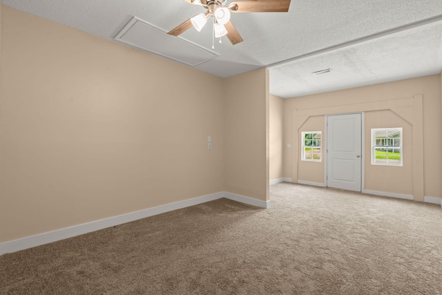 8116 Long Shadow Ln, North Charleston, SC 29406 - spare room with attic access, carpet, ceiling fan, and a textured ceiling
