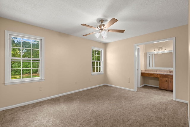 8116 Long Shadow Ln, North Charleston, SC 29406 - unfurnished bedroom featuring light colored carpet, a textured ceiling, connected bathroom, and a ceiling fan